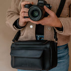 Compacte camera schoudertas voor reizen en city trips